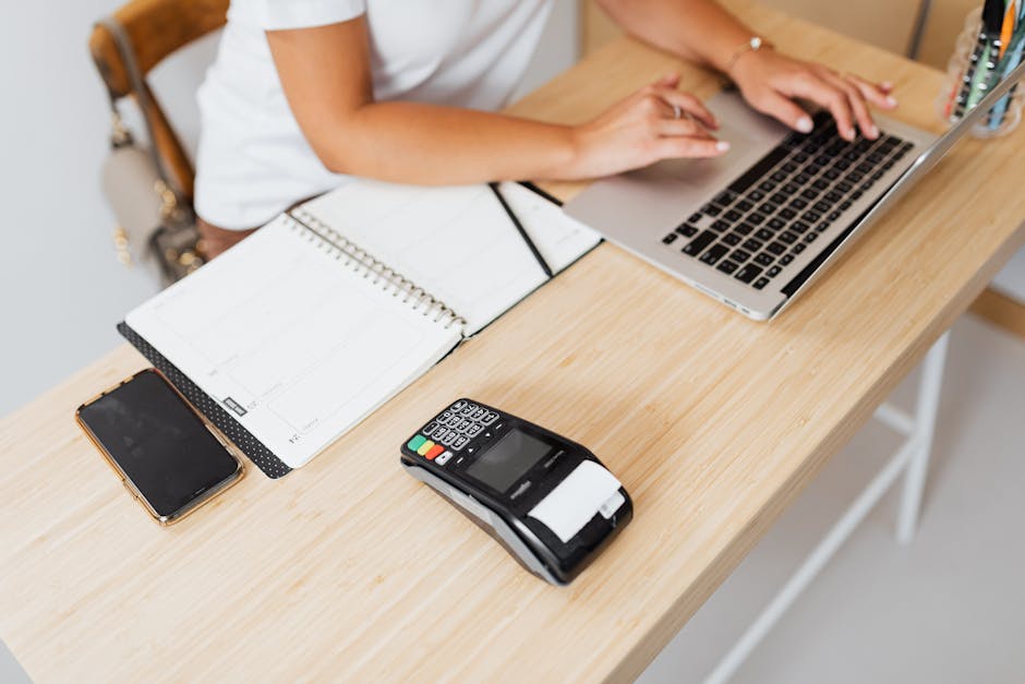 Reviewing a performing business note at a desk workspace